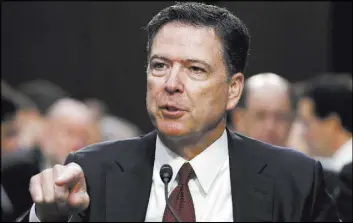  ?? Alex Brandon The Associated Press ?? Ex-FBI Director James Comey notified President Donald Trump about a dossier compiled by opposition firm Fusion GPS, which had done work on behalf of Russia.