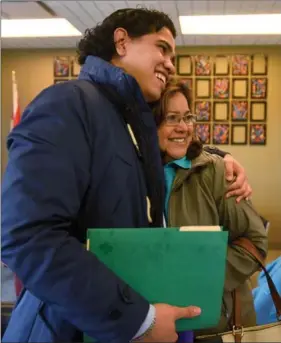  ??  ?? Alvaro Beltran celebrates with his aunt, Margaret Rivas, after clearing the first hurdle to join her in Hamilton permanentl­y.