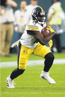  ?? JEFF HAYNES/AP ?? James Washington runs after a catch against the Packers on Oct. 3 in Green Bay, Wis. He logged his fewest plays of the season Sunday.