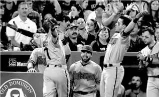  ?? BARRY CHIN/GLOBE STAFF ?? Cody Ross (left) got his teammates excited with a go-ahead home run in the seventh.