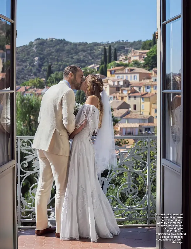  ??  ?? Alizée looks beautiful in a wedding gown that was originally worn by her motherin-law Carole at her own wedding in 1980. “It was amazing to give such a beautiful dress a second lease of life,” she says