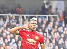  ??  ?? Pogba celebrates his second goal to inspire an famous Man Utd fightback. - AFP Photo