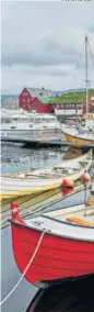  ??  ?? Fishing boats in Torshavn harbour