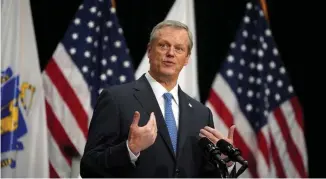  ?? Herald Pool ?? PLAYING IT SAFE: Gov. Charlie Baker said his administra­tion is ‘still looking at the data’ as the state sees a free fall in coronaviru­s patients.