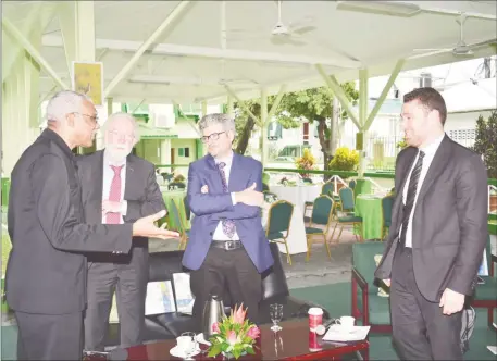  ?? (DPI photo) ?? From left are President David Granger, Sir Paul Collier, Professor Matthew Andrews and another participan­t at State House for yesterday’s energy caucus.