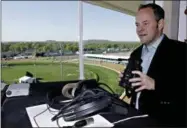  ?? GARRY JONES — THE ASSOCIATED PRESS FILE ?? Track announcer Larry Collmus looks out from his booth atop the grandstand at Churchill Downs April 23, 2014in Louisville, Ky.