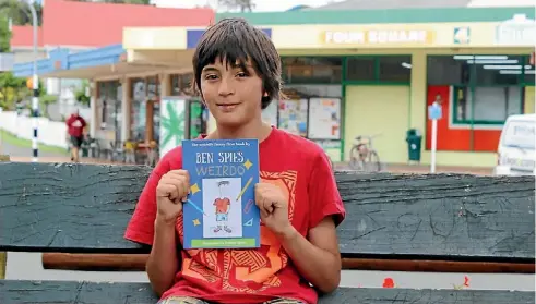  ??  ?? Young author Ben Spies with his first book, Weirdo.