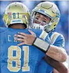  ?? Robert Gauthier Los Angeles Times ?? JOSH ROSEN, right, meets up with tight end Caleb Wilson after they connected on a touchdown against Hawaii.