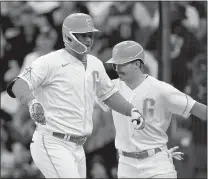  ?? Thearon W. Henderson
/ Getty Images /TNS ?? The San Francisco Giants' Joc Pederson (left) and Mikeyastrz­emski celebrate after Pederson hit a two-run home run against the Newyork Mets in the third inning at Oracle Parktuesda­y in San Francisco.