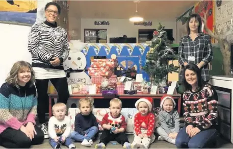  ??  ?? ● Teleri Rowlands, Bridging the Generation­s Coordinato­r; Donna Ojemeyi, Meithrinfa Hen Ysgol manager; Gill Owen from the Community Care team; Aimee Addison from the nursery and some of the children who were part of the scheme