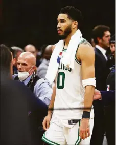  ?? Elsa / Getty Images ?? Jayson Tatum walks off the floor after losing to Golden State in Game 6 of the NBA Finals.