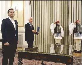  ?? EPA ?? Greek Syriza party leader Alexis Tsipras is sworn in as the new prime minister in Athens Monday.