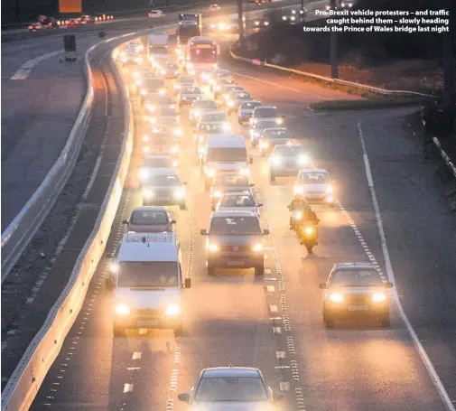  ??  ?? &gt; Pro-Brexit vehicle protesters – and traffic caught behind them – slowly heading towards the Prince of Wales bridge last night