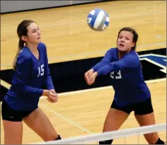  ?? Tommy Romanach / Rome News-Tribune ?? Model’s Brooke Roberts (left) and Emma Dickinson react after Dickinson connects for a return during a volleyball match against Lakeview-Fort Oglethorpe on Thursday at Model High School.