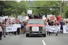  ?? TORI LYNN SCHNEIDER/USA TODAY NETWORK ?? Protesters march through Tallahasse­e in June, demanding the removal of the city’s police chief after a series of fatal shootings by officers. The chief cited Marsy’s Law in refusing to name the officers.