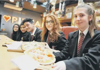  ??  ?? Pupils from Thornhill School tuck into their pizzas at the Roker Hotel’s Italian Farmhouse.