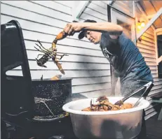  ?? RICK O’BRIEN/SUBMITTED PHOTO ?? A seafood lover, the late Jon Bil hosts a backyard lobster/clambake on P.E.I. in this file photo.