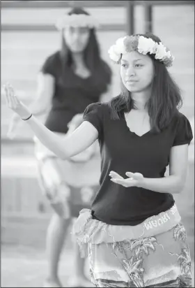  ?? NWA Democrat-Gazette/File Photo ?? Lillian Chonggum of Springdale dances a traditiona­l Marshalles­e dance Sept. 19 during the Welcoming NWA: Celebratin­g the Cultural Diversity of Northwest Arkansas event at Shiloh Square in downtown Springdale.