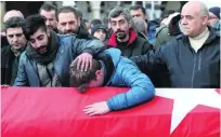  ?? Sedat Suna / EPA ?? Relatives and friends mourn during the funeral of Ayhan Arik, one of the 39 victims of the gun attack on the Reina.