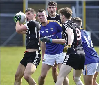  ??  ?? Sligo’s Adrian McIntyre, Niall Murphy and Kevin McDonnell in action with David McGivney and Dessie Reynolds of Longford during the Allianz League Division 3 Rd 5 match in Markievicz Park.