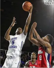  ?? MARK HUMPHREY / AP ?? Forward Nick King (5) leads Middle Tennessee in scoring and rebounding after transferri­ng from Alabama. King began his career at Memphis.