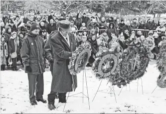  ?? IAN STEWART / SPECIAL TO THE RECORD ?? Wreaths are laid during the German-Canadian Remembranc­e Day service Sunday at Woodland Cemetery. The 187 German soldiers buried there died in Canada while prisoners of the First and Second World Wars.