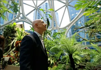  ??  ?? in this 2018 file photo Jeff bezos, the Ceo and founder of Amazon.com, takes a walking tour of the Amazon Spheres in Seattle. AP Photo/ted S. WArren