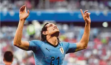  ?? PIC AFP ?? Uruguay forward Edinson Cavani celebrates after scoring during their World Cup Group A match against Russia on Monday.