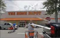  ?? THE ASSOCIATED PRESS FILE PHOTO ?? Home Depot earned $2.17 billion in the third quarter.