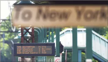  ?? Tyler Sizemore / Hearst Connecticu­t Media ?? The rush-hour train schedule is posted at the Greenwich Metro-North station on June 10.