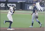  ?? JAE C. HONG — THE ASSOCIATED PRESS ?? The Astros’ Carlos Correa runs past the Rays’ Willy Adames after hitting a walk-off homer during the ninth inning of Game 5of the ALCS on Thursday.