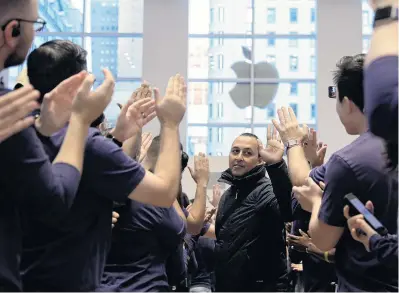  ?? PHOTO: REUTERS ?? Congratula­tions . . . Apple Inc becomes the world’s first $US1 trillion ($NZ1.48 trillion) company.