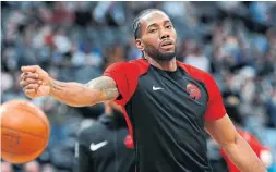  ?? DAVID ZALUBOWSKI THE ASSOCIATED PRESS ?? Raptors forward Kawhi Leonard warms up before Sunday’s game in Denver. Toronto has gone 7-1 in games played without its new star.