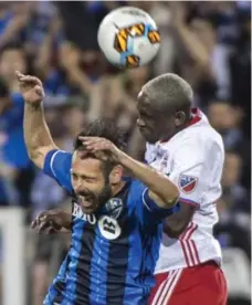  ?? PAUL CHIASSON/THE CANADIAN PRESS FILES ?? Impact forward Matteo Mancosu gets the worst of this aerial battle with TFC defender Chris Mavinga in the first leg in Montreal, which ended 1-1.