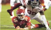  ?? CHARLIE RIEDEL/ASSOCIATED PRESS ?? Kansas City Chiefs quarterbac­k Patrick Mahomes is slow to get up after throwing under pressure from New York Giants defensive end Leonard Williams on Nov. 1 in Kansas City, Mo.