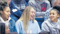  ?? BRAD HORRIGAN/HARTFORD COURANT ?? In attendance for UConn's game against Notre Dame on Sunday were, from left, Amari DeBerry, Paige Bueckers and Azzi Fudd . DeBerry was the No. 5 overall prospect for the Class of 2021.