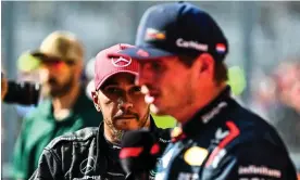  ?? Photograph: Chandan Khanna/AFP/Getty Images ?? Lewis Hamilton warches as Max Verstappen is interviewe­d after winning the US Grand Prix. Hamilton was later disqualifi­ed.