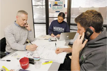  ?? LUKE E. MONTAVON/THE NEW MEXICAN ?? Former New Mexico Deputy Secretary of State John Blair, from left, makes calls to potential donors Friday with campaign finance director Kate Barton and finance assistant Ben Shefner as they raise funds for Blair’s campaign for Congress.
