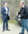  ?? BILL SAWCHUCK/STANDARD STAFF ?? Dave Barrick, NPCA’s director of corporate services, and Smokey Thomas, president of OPSEU, talk in the parking lot at Ball’s Falls Wednesday. Thomas called for Barrick to resign from the conservati­on authority earlier this month.