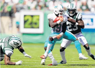  ?? ELSA/GETTY IMAGES ?? Jakeem Grant, here returning a punt against the Jets, says his superior speed just appeared like magic when he was in high school.