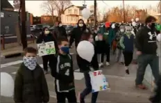  ?? KDKA-TV ?? Parents, students and other supporters of St. Philip Catholic Church in Crafton marched recently to voice their concerns about the planned closure of the parish’s elementary school.