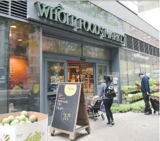  ?? TIMOTHY A. CLARY/AFP/GETTY IMAGES FILES ?? Amazon’s move to slash food prices after its purchase of Whole Foods is a great example of the groundbrea­king impact of technology in this decade, writes Martin Pelletier.