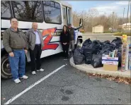  ?? ?? Left to right: Zuber Realty agents Brian Gilbert and Karl Stauffer, Salvation Army Captain Rebecca Smith, Zuber Realty owner Richard A. Zuber drop off donations for Toys for Tots at the Salvation Army of Boyertown.