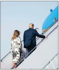  ?? The New York Times/SARAH SILBIGER ?? President Donald Trump and his wife, Melania, board Air Force One on Thursday at Joint Base Andrews, Md., on their way to an Easter weekend at Trump’s Mar-a-Lago resort in Florida.