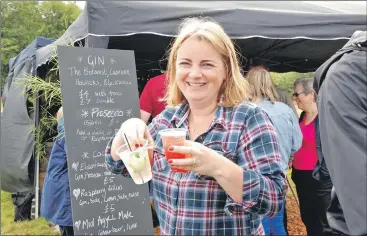  ?? 06_a33MAShow6­6 ?? Lochgilphe­ad’s Sinead Grey sampling the delights of the gin and Prosecco bar. The drinks were not, apparently, all for her.