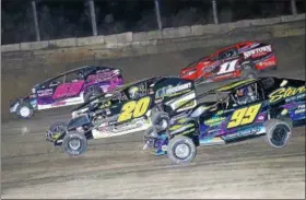  ?? PHOTOS KUSTOM KEEPSAKES ?? Modified action Kolby Schroser No. 99, Brett Hearn No. 20, Brian Berger No. 60and Kyle Armstrong No. 11A at Lebanon Valley Speedway Saturday night.