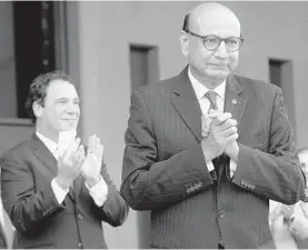  ?? ALGERINA PERNA/BALTIMORE SUN ?? Khizr Khan, foreground, appeared at a rally last summer in Towson and received a citation from Baltimore County Executive Kevin Kamenetz, rear.