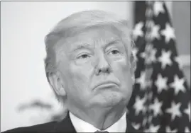  ?? ALEX BRANDON / AP ?? President Donald Trump stands Thursday during an event to announce a Merck, Pfizer, and Corning joint partnershi­p to make glass containers for medication, in the Roosevelt Room of the White House.