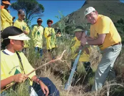  ??  ?? COMMITTED: Then-Water and Forestry Affairs Minister Ronnie Kasrils helps clear invasive alien plants as part of the working for water programme, left, and right, recruits go through training as part of the government’s Expanded Public Works Fire...