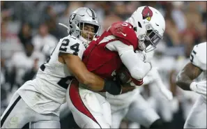  ?? RALPH FRESO — THE ASSOCIATED PRESS ?? Oakland defensive back Johnathan Abram (24) tackles Arizona Cardinals running back David Johnson (31) during the first half of a preseason game.